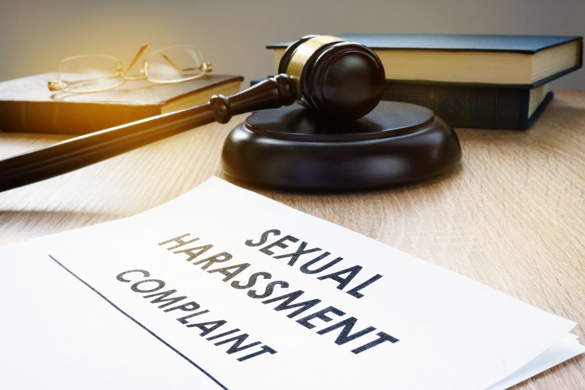 Sexual harassment complaint form on desk with gavel, for the best Chicago sexual harassment lawyer call our firm.