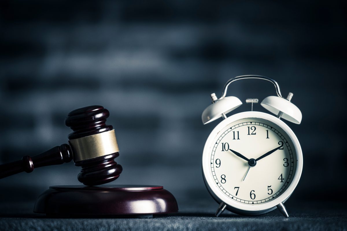 Gavel with a clock for concept of statute of limitations with Employment Law Firm Chicago.